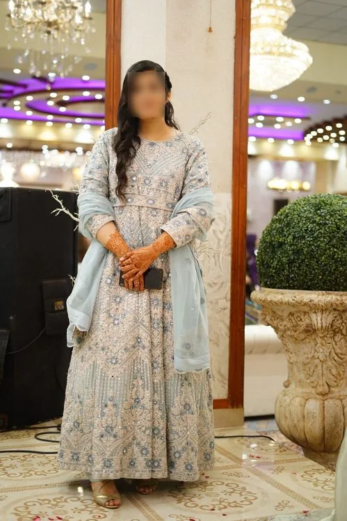 Graceful bride dressed in embroidered pastels for her matrimonial celebration
